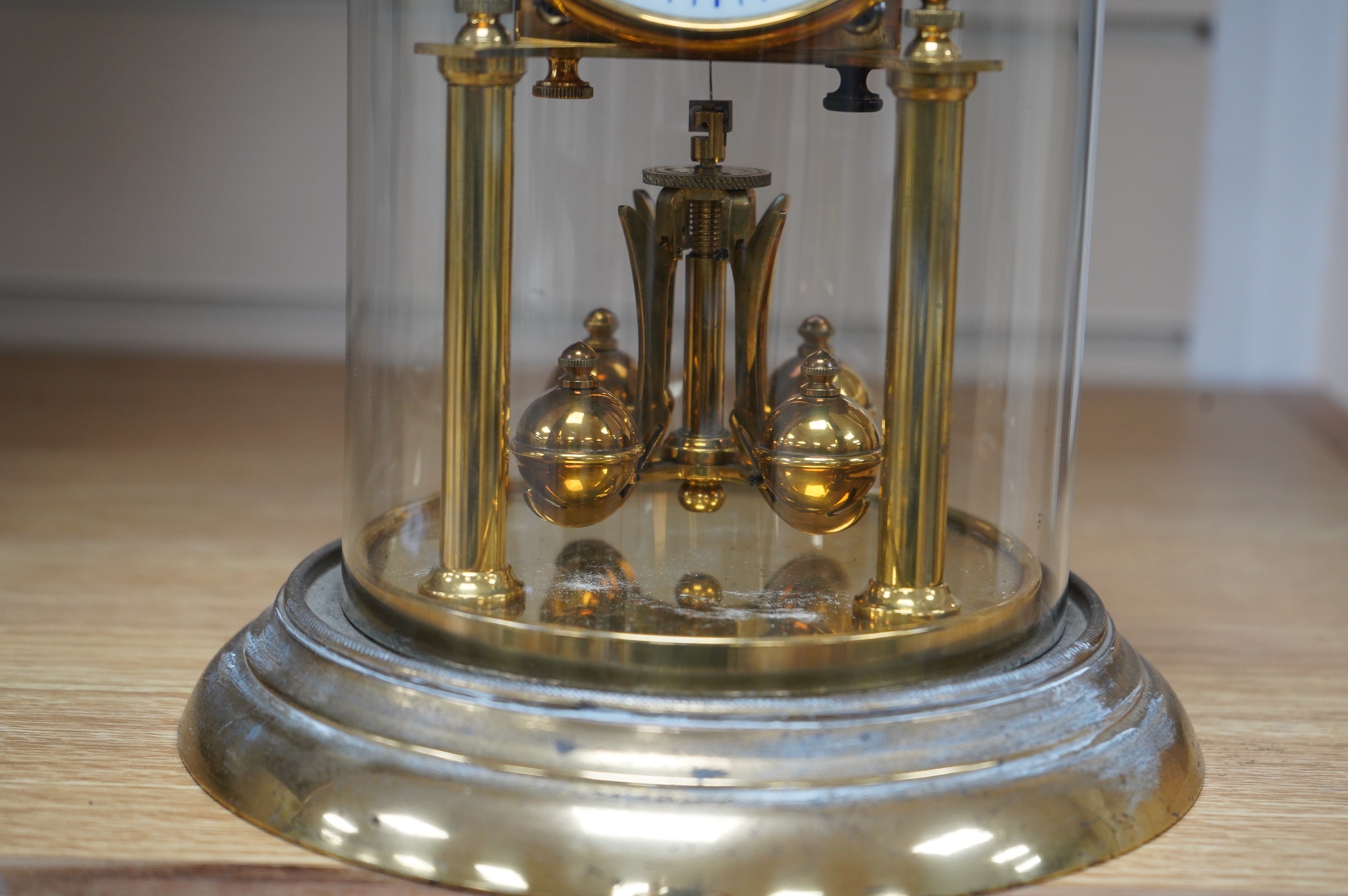 A late 19th century German 400 day torsion clock under dome, 26cm. Condition - fair to good. Not tested
